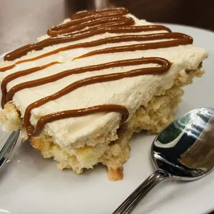 a piece of cake on a plate with a spoon