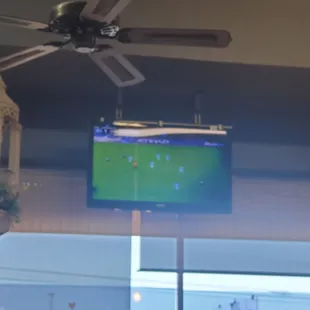 Soccer on a Saturday. Premier League? I see Chelsea is playing, but can't see the logo for the other team.