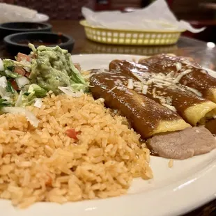 Three corn enchiladas (beans, cheese, &amp; chicken) with guac salad and rice.