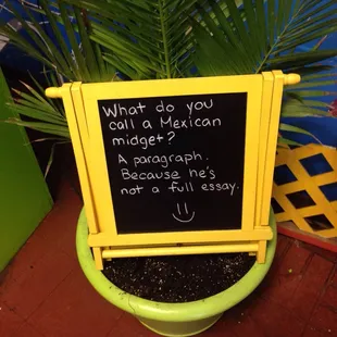a sign in a pot