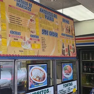 menus on the wall of a mexican restaurant