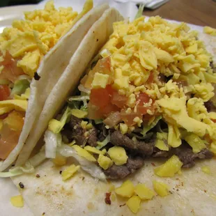 Two Tacos Al Carbon with Cheese -