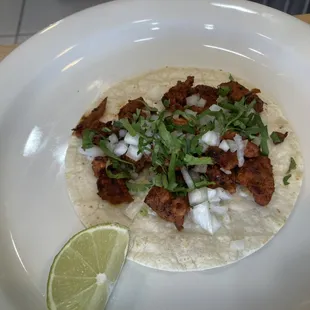 Al pastor, pork, onions, cilantro, lime