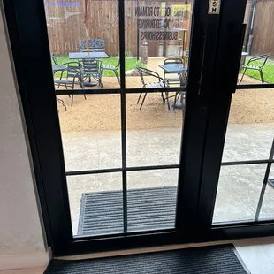 a view of a patio through a glass door