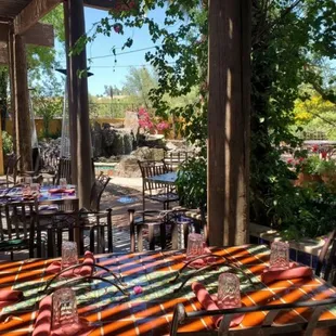 Covered patio with flowers, birds singing and an almost tropical breeze!