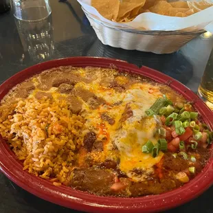 Cheese enchilada with rice and beans. Very hot dish!