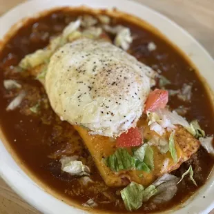 Enchirito Burrito! Enchilada with red sauce but with a flour tortilla &amp; fried egg.