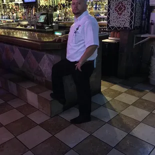 a man sitting at a bar