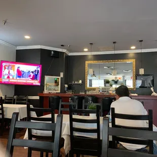 a man sitting at a table in a restaurant