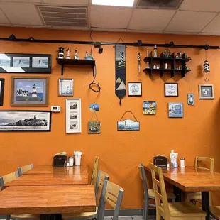 a dining area with tables and chairs