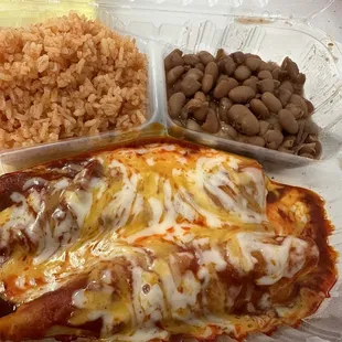 Two pork enchiladas, rice and beans included