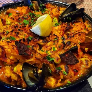 a dish of seafood and rice