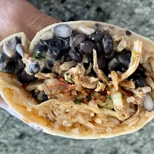  hand holding a burrito