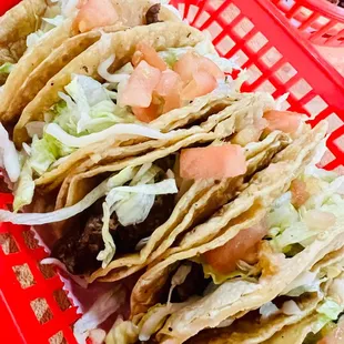 a red basket filled with tacos