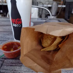 Stale chips in a bag.$2.99 Coke.