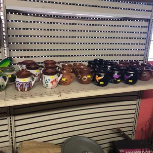 a shelf of jars and bowls