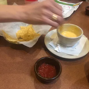 Chips, salsa, Queso, and a nice hand!