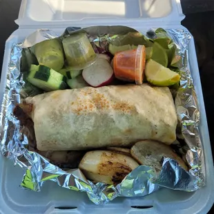 a burrito and vegetables