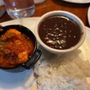 a bowl of black beans and a bowl of rice