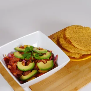 Shrimp veggie dish (Aguachile)  a spicy shrimp dish with fresh cucumbers, onions, tomatoes lime avocado slices etc.