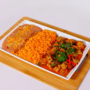 Carnitas dinner: served with rice  beans and tortillas. please ask for spice level (mild med or hot)