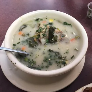 a bowl of soup with a spoon