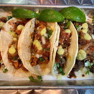 three tacos on a tray