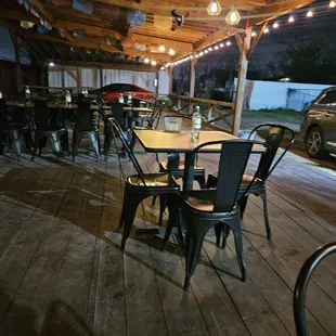 a patio with tables and chairs