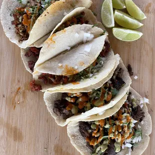 Homemade tortilla tacos carne asada and birria