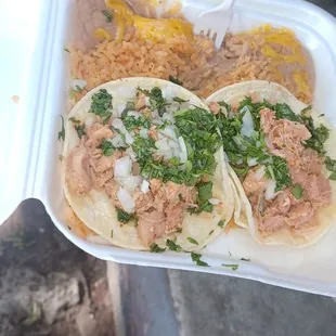 Street tacos with shredded chicken and rice