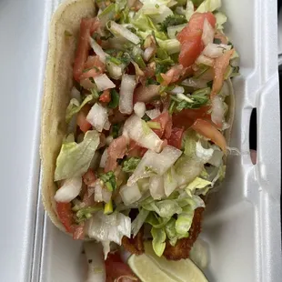 Fish taco but forgot the tartar... I can see why this place is empty.