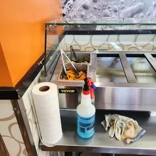 Spraying salsa bar with windex while food was still in place.