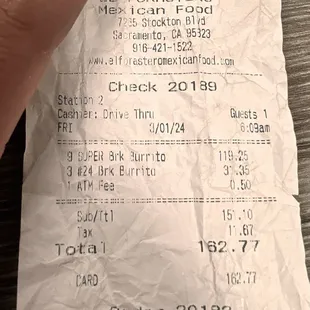 a person holding a receipt