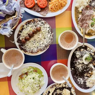Memelitas, taquitos, enmoladas, carne asada and enchiladas campechanas and hot chocolate