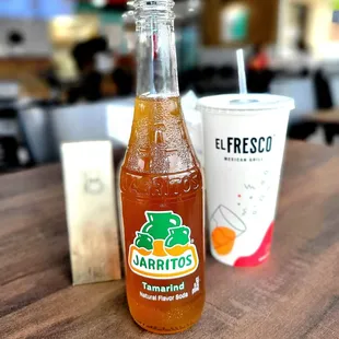 Tamarind Jarritos drink and their single size fountain soda cup.