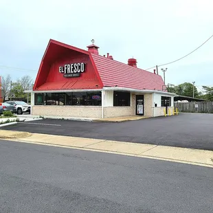 The storefront and a view of the right side parking lot.