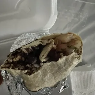 Shrimp burrito with all the add-ons. As you can see, there&apos;s no cheese, sour cream, and hardly any lettuce.