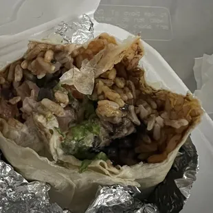 Shrimp burrito with all the add-ons. No sour cream, cheese, and HARDLY any lettuce.