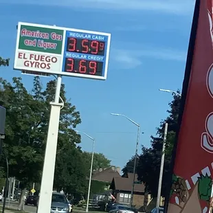 Street sign of El Fuego Gyros and American Gas