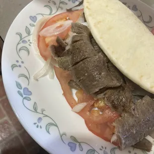 Gyro with onions and tomatoes and tzatziki sauce!!!