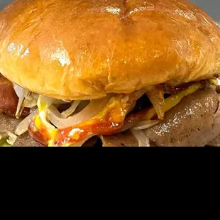 gyro sandwich on a brioche with caramelized onions