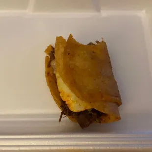 a sandwich in a styrofoam container