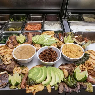 Charola Familia includes Carne Asada, chicken fillet, shrimp, carnitas, 4 taquitos, onions, chile toreado, queso fresco, avocado, &amp; lime.