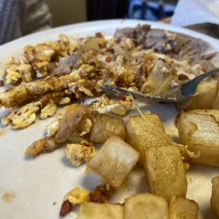 Chorizo and eggs that were too dry to finish up. The potatoes looked great but were raw on the inside.