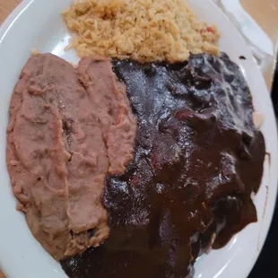 Pollo in mole.  Shredded chicken breast!  Love their rice &amp; beans too!