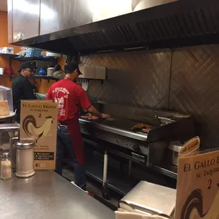 a man preparing food in a restaurant kitchen