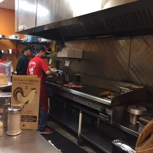 a man preparing food in a restaurant kitchen