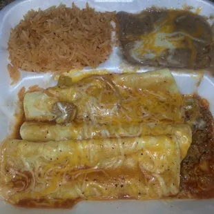 a plate of enchiladas and rice