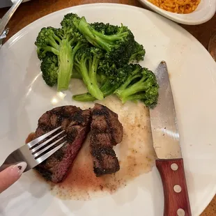 Filet mignon and seasoned-steamed broccoli.