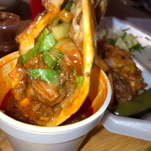 a hand holding a piece of food